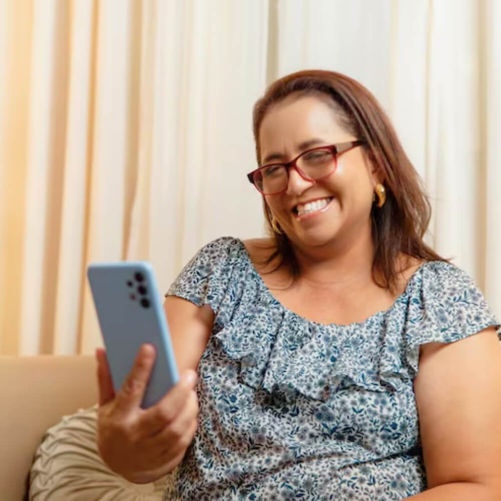 Woman looking at phone confidently