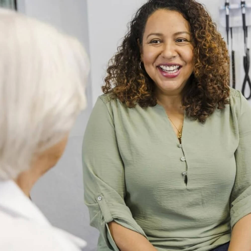 Three confident women smiling